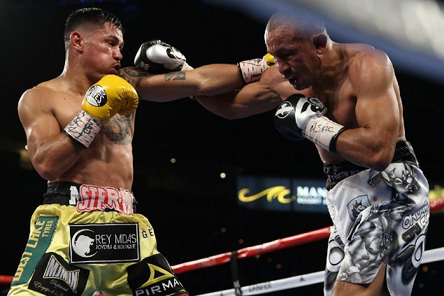 unior lightweight Miguel "Mickey" Roman (left) vs. Orlando Salido. Photo credit: Ed Mulholland/HBO Boxing