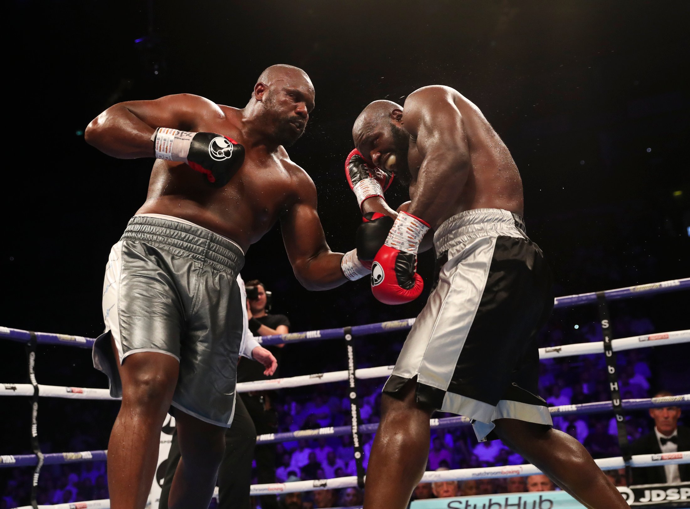 Heavyweight Dereck Chisora (left) attacks Carlos Takam. Photo by Lawrence Lustig