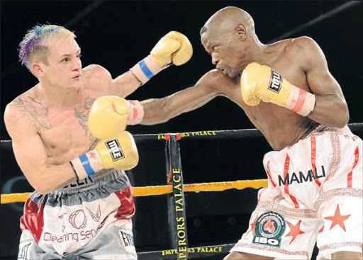 Hekkie Budler (left) proved his boxing acumen and made detractors accept him, when he beat Mdantsane’s favorite son Nkosinathi Joyi, at Emperors Palace, in 2013. Photo credit: Gallo Images