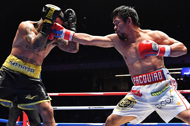 Welterweight Manny Pacquiao (right) jabs at Lucas Matthysse. Photo courtesy of Reuters and Golden Boy Promotions