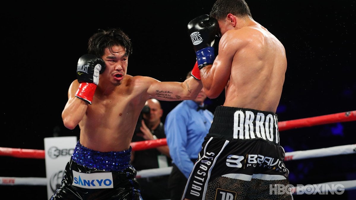 Three-division titlist Kazuto Ioka (left) connects with a left hook against McWilliams Arroyo. Photo / @HBOBoxing