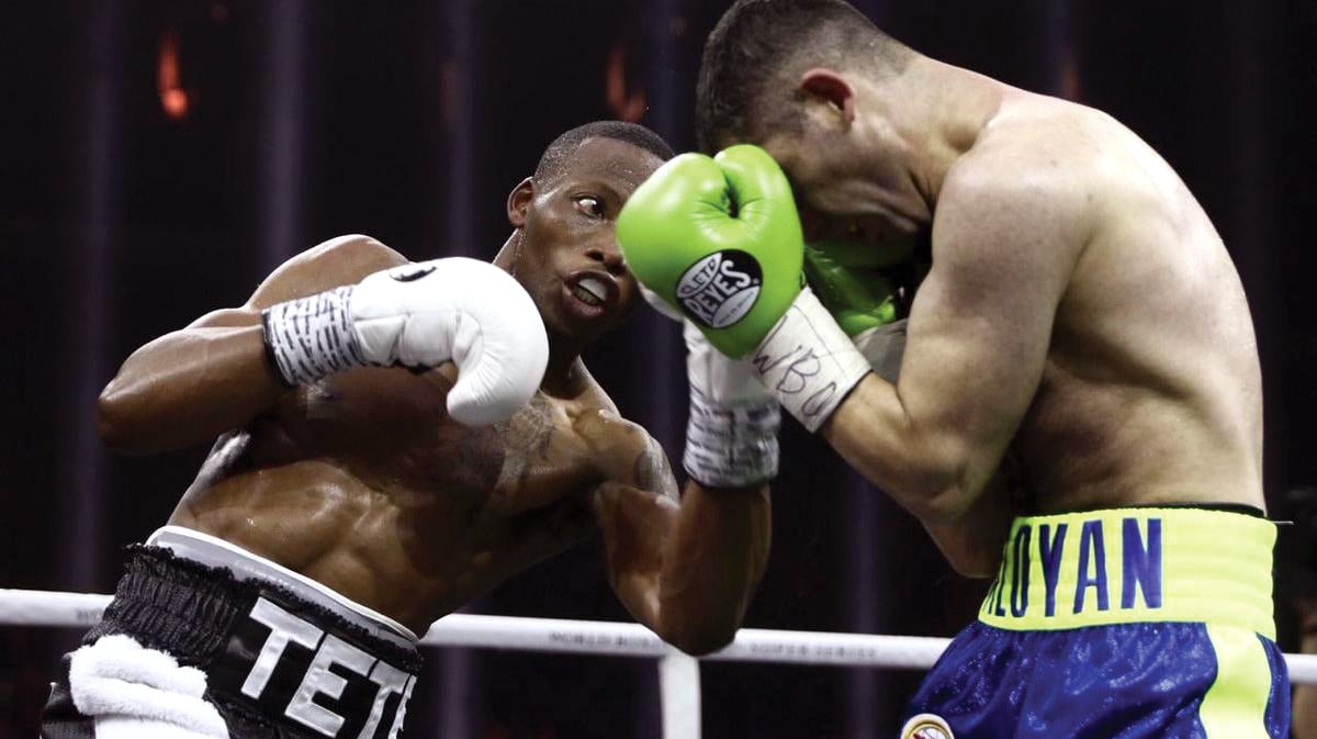 Zolani Tete (left) handled a tough challenge from Mikhail Aloyan to win by unanimous decision.