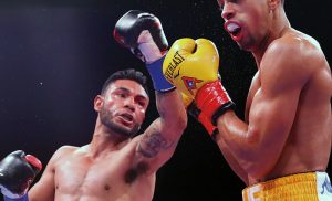Andrew Cancio (left) lands a left against Alberto Machado during their junior lightweight bout at Fantasy Springs Casino on February 9, 2019 in Indio, California. (Photo by Tom Hogan/Golden Boy/Getty Images)