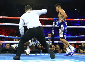 Emanuel Navarrete (standing) sends Isaac Dogboe to canvas. Photo by Mikey Williams-TOP RANK