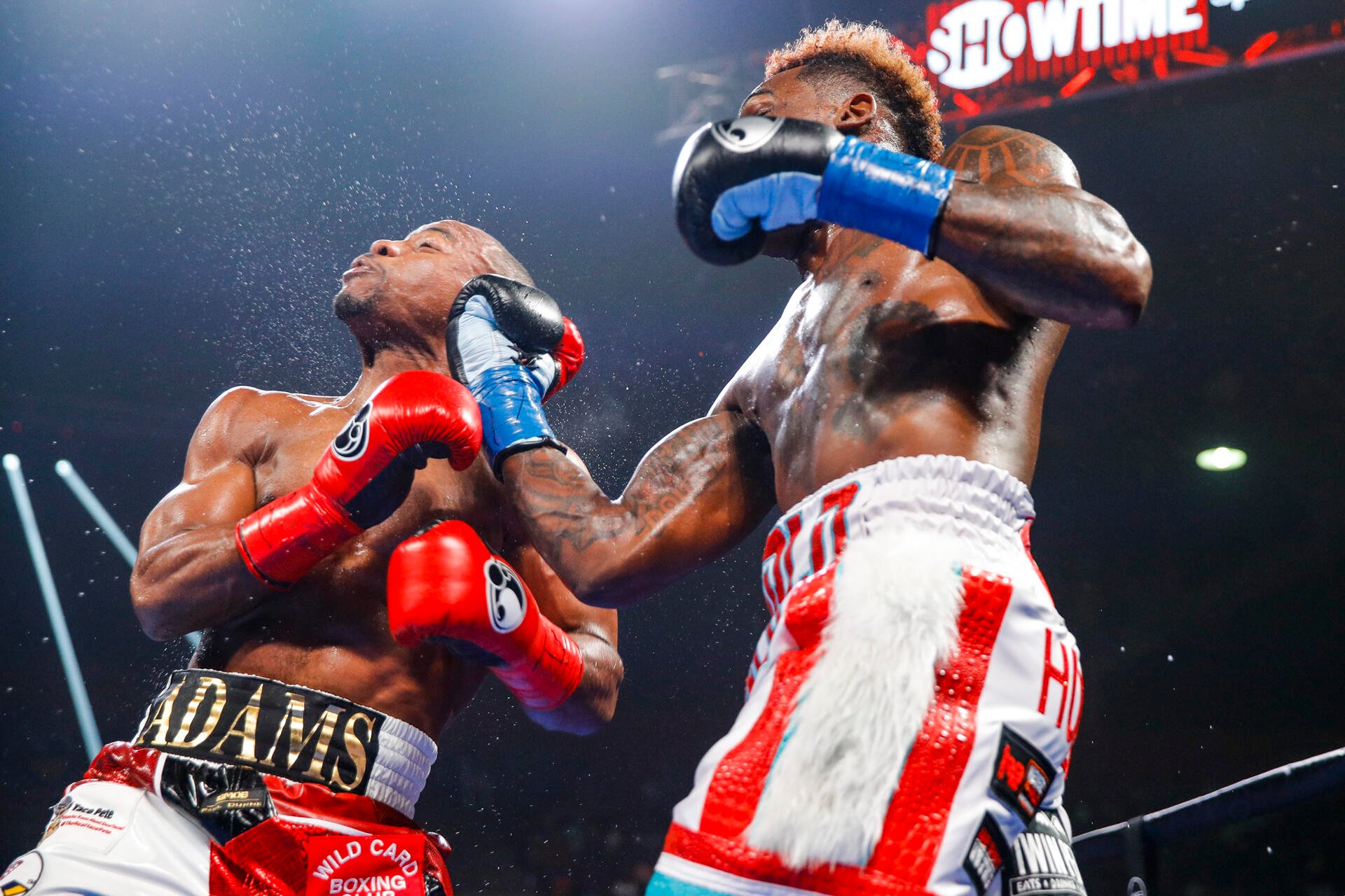 Jermall Charlo's (right) right uppercut jolted Brandon Adams more than a few times during the course of 12 rounds. Photo by Esther Lin/Showtime.