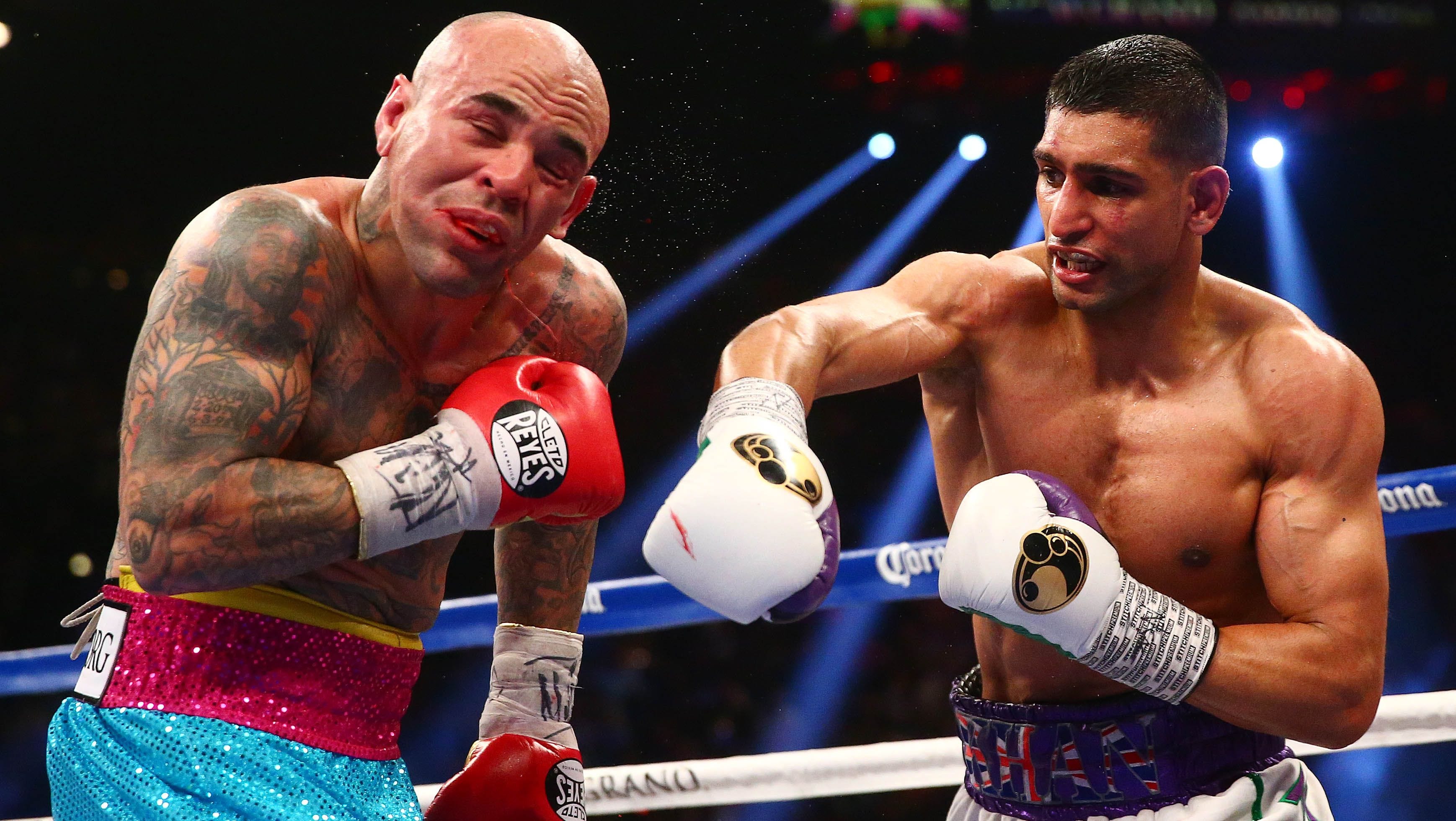 Amir Khan (right) vs. Luis Collazo. Photo credit: Mark J. Rebilas/USA TODAY Sports