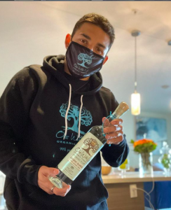 Teofimo Lopez holds a bottle of One With Life Organic Tequila, the product the concept of Lisa Elovich.. 