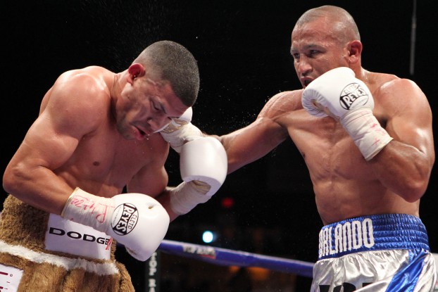 Puerto Rican slugger Juan Manuel Lopez (left) and Mexican pressure fighter Orlando Salido continued the fierce boxing rivalry of their cultures when they fought in March 2012. Photo by Chris Farina / Top Rank
