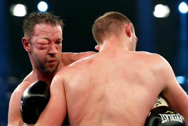 Enzo Maccarinelli (L) of Wales fights with an injured eye during his WBA light heavyweight title fight against Juergen Braehmer on April 5, 2014 in Rostock, Germany.  (Photo by Boris Streubel/Bongarts-Getty Images)