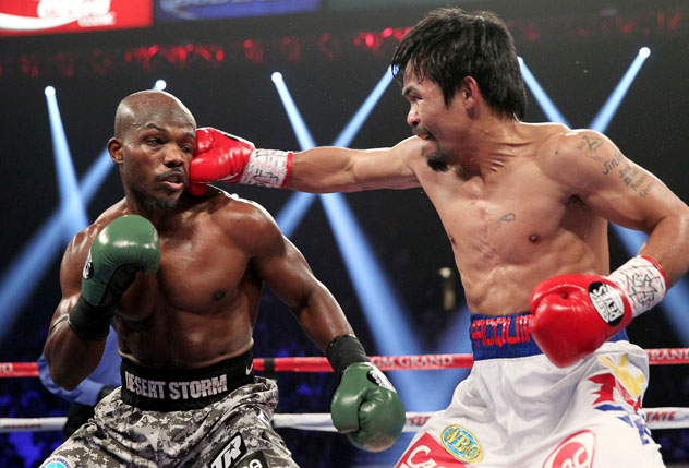 Manny Pacquiao (R) in his rematch with Tim Bradley on April 12, 2014, in Las Vegas. Photo by Chris Farina - Top Rank.