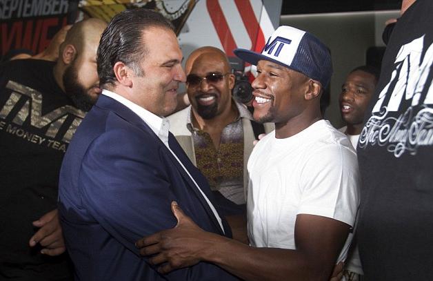 Floyd Mayweather Jr. recently hinted that his business relationship with Leonard Ellerbe (center) might be ending. Could former Golden Boy CEO Richard Schaefer (left) be next in line to head up Mayweather Promotions?