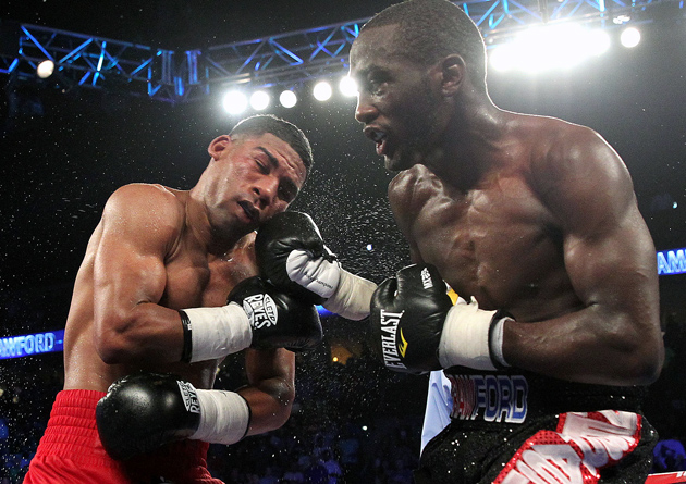 Yuriorkis Gamboa (L) tangled with Terence Crawford and lost (with four knockdowns) in 2014, but the Cuban still showed the qualities that made him an Olympic gold medalist and world titleholder. Photo by Chris Farina/Top Rank.