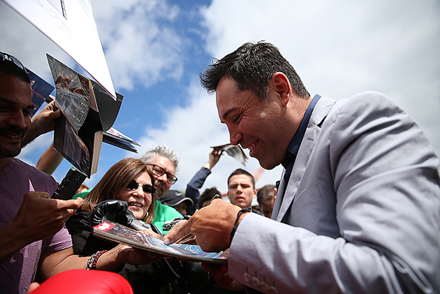 Oscar De La Hoya signs autographs for fans on June 6, 2014 in Canastota, New York outside the museum of the International Boxing Hall of Fame during induction weekend. Photo by Alex Menendez - Hoganphotos/Golden Boy Promotions