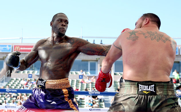 Deontay Wilder (L) lands a punch on Jason Gavern during their fight on August 16, 2014, which Wilder won by fourth-round TKO. Photo by Stephen Dunn - Getty Images.