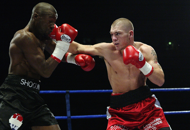 Jamie Moore lands a straight right on Gary Logan during the first defense of his British and Commonwealth junior middleweight titles on Oct. 18, 2003 in Manchester. Moore retired in 2010 and is now a trainer. Photo by John Gichigi/Getty Images