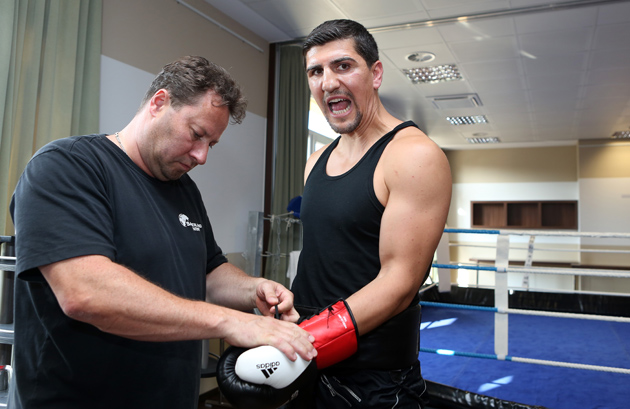 Marco Huck has his gloves put on for a training session on August 6 in Neuruppin, Germany. The long-reigning WBO cruiserweight beltholder is preparing for his title defense against Mirko Larghetti. Photo by Adam Berry/Bongarts/Getty Images