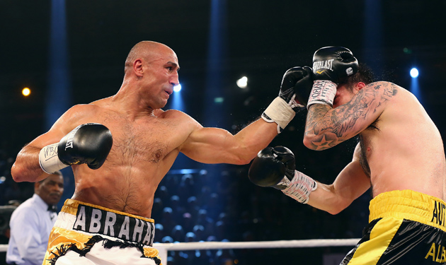 Arthur Abraham (left) takes it to Paul Smith (right) during their WBO super middleweight title fight at Sparkassen Arena on Sept. 27 in Kiel, Germany. Photo by Martin Rose/Bongarts/Getty Images