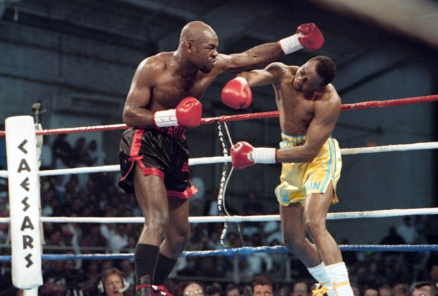 Iran Barkley lobs a monster hook at  Thomas Hearns during their 1993 rematch at Caesars Palace in Las Vegas, Nevada. Barkley won the WBA light heavyweight title with a split decision. Photo from THE RING archives