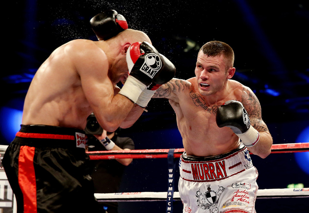 Martin Murray (right) in action with Sergey Khomitsky during their middleweight bout at ExCel on Dec. 14, 2013 in London, England. Photo by Scott Heavey/Getty Images