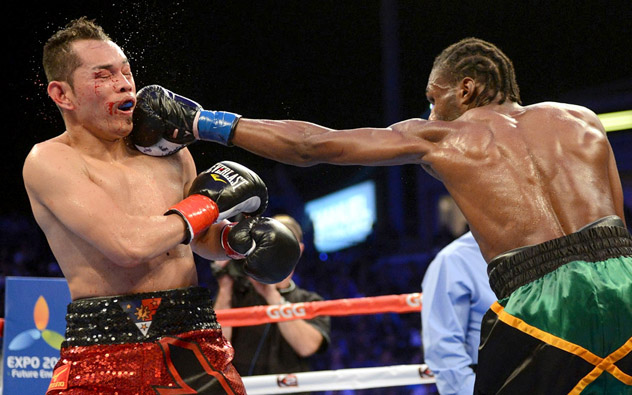 Nonito Donaire Jr., catching a jab from Nicholas Walters during their WBA featherweight title bout in October 2014, says he must go back to a hit-and-not-get-hit boxing style in order to remain in the sport at the world-class level. Photo by Naoki Fukuda