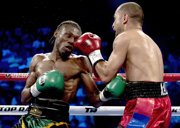 Nicholas Walters (left) takes it to veteran Vic Darchinyan en route to a fifth-round stoppage victory in Macau on May 31. Photo by Anthony Wallace/AFP/Getty Images