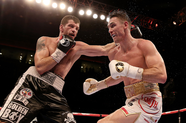 British super middleweight prospect Callum Smith (R) exchanges punches with Nikola Sjekloca en route to a one-sided unanimous decision on Nov. 22, 2014, in Liverpool, England. Photo by Scott Heavey / Getty Images