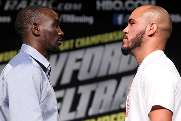 Terence Crawford (L) and Raymundo Beltran, THE RING's Nos. 1 and 2-rated lightweights, engage in a staredown at the kick-off press conference for their Nov. 29 showdown in Omaha, Nebraska. Photo by Chris Farina-Top Rank