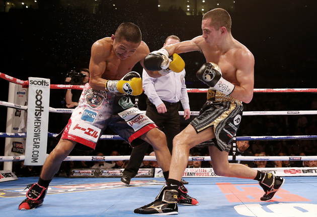 Scott Quigg in action with Hidenori Otake during their junior featherweight bout at Liverpool Echo Arena on Nov. 22 in Liverpool, England. Quigg won a unanimous decision. Photo by Scott Heavey/Getty Images