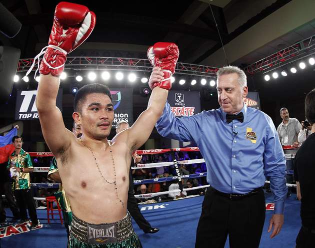 Brian Viloria poses after scoring a fourth-round TKO over Armando Vasquez on Dec. 6 in Glendale, California. Photo by Mikey Williams-Top Rank