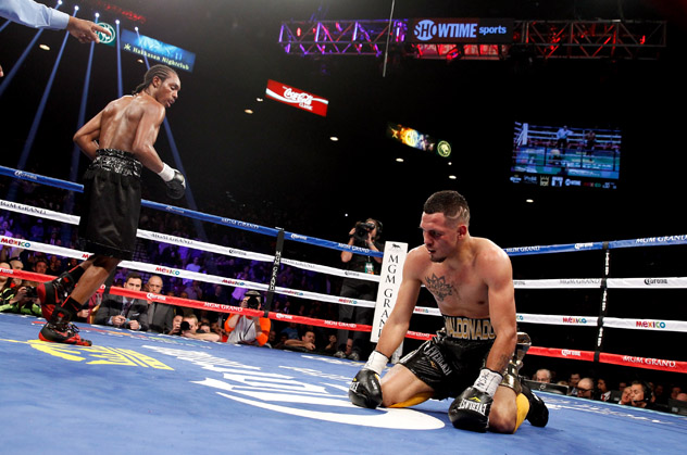 Amir Imam (L) heads to a neutral corner after knocking down Fidel Maldonado Jr. in the fifth round of their super lightweight fight at the MGM Grand Garden Arena on January 17, 2015 in Las Vegas, Nevada. Imam won by fifth-round TKO.  (Photo by Steve Marcus/Getty Images)
