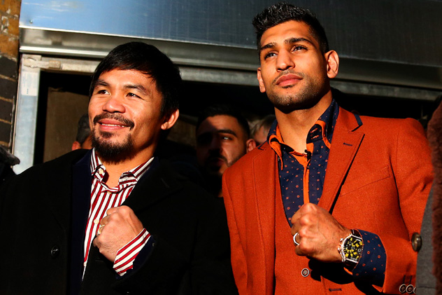 Manny Pacquiao (L) with Amir Khan on Jan 23. 2015, in London, where the two reportedly discussed the possibility of a May 30 fight. Photo by Dan Istitene/Getty Images.