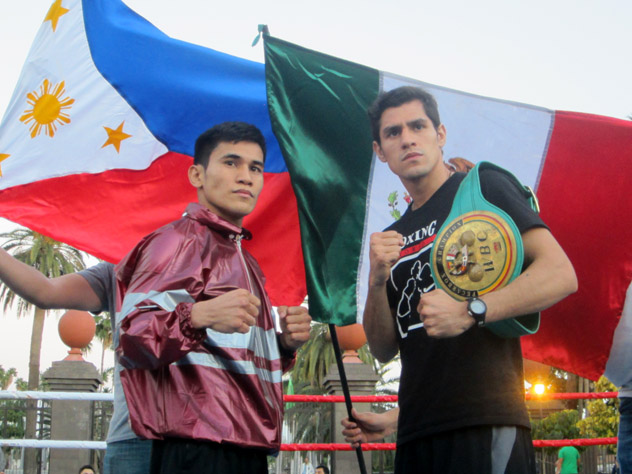 Adrian Estrella (R) posing with Feb. 14 opponent Adones Aguelo