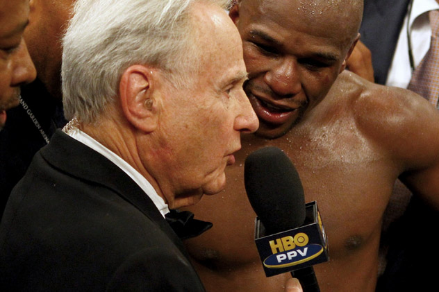 Larry Merchant interviews Floyd Mayweather Jr. following his win over Miguel Cotto in 2012. Photo by Al Bello/Getty Images.