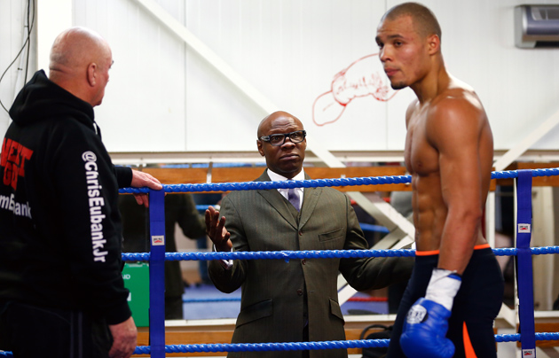 Chris Eubank Jr. is watched by father Chris Eubank during a media work out at the Peacock Gym on Feb. 24, ahead of his fight with Dmitry Chudinov in London, England. Photo by Julian Finney/Getty Images