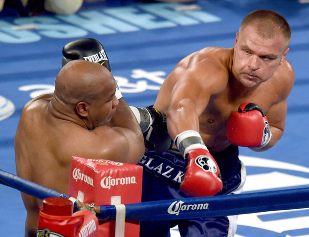 Vyacheslav Glazkov (R) throws a right at Darnell Wilson during their heavyweight fight in November 2014. Glazkov stopped Wilson in the seventh round. Photo by Don Emmert/AFP-Getty Images.