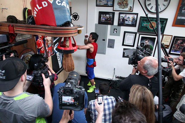Manny Pacquiao surrounded by the media while training for his May 2 bout against Floyd Mayweather Jr. Photos by Chris Farina/Top Rank.