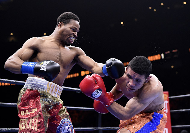 Shawn Porter (L) hammers Erick Bone en route to a fifth-round knockout in March 2015. The win was Porter's comeback from his loss to Kell Brook the previous August. Photo by Kevork Djansezian/Getty Images.