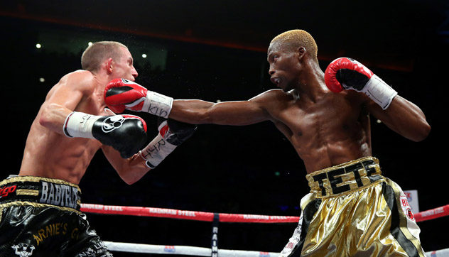 Butler (l) tagged by IBF junior bantamweight titleholder Zolani Tete. Photo by Alex Livesey/Getty Images.
