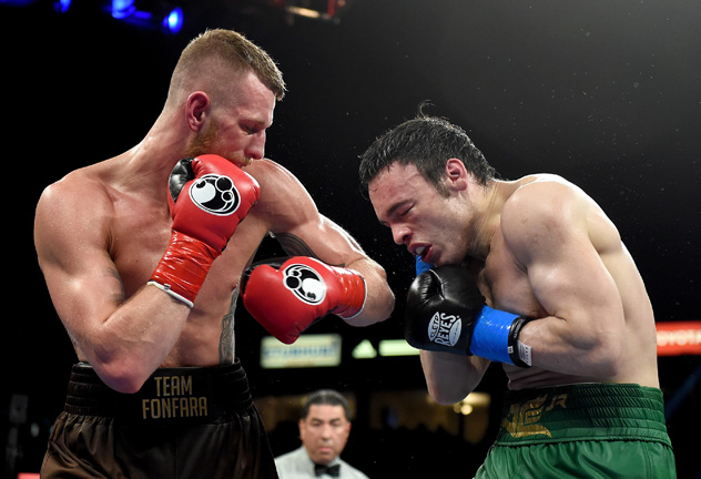 LOS ANGELES, CA - APRIL 18: Andrzej Fonfara punches Julio Cesar Chavez Jr. en route to a ninth round TKO in their light heavyweight bout at StubHub Center on April 18, 2015 in Los Angeles, California. (Photo by Harry How/Getty Images)