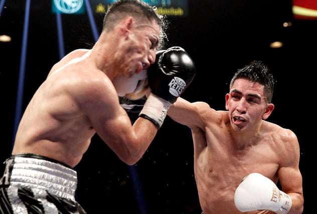 Jan. 17, 2015: Leo Santa Cruz (R) smashes Jesus Ruiz en route to an eighth-round TKO in Las Vegas. Photo by Steve Marcus/Getty Images.