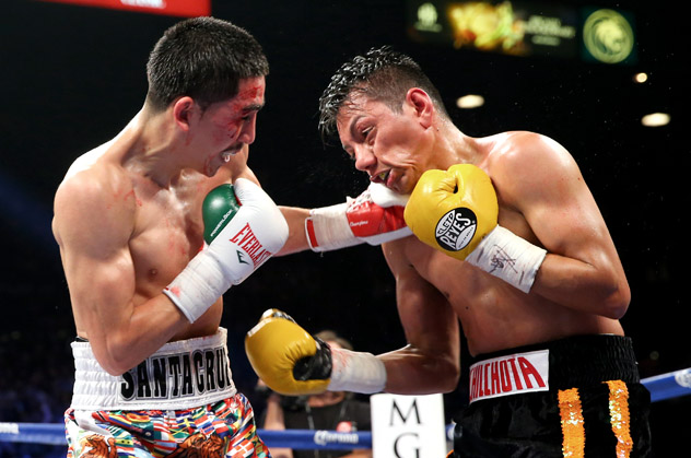 Leo Santa Cruz (L) would go on to win a shutout decision over Cristian Mijares in this 2014 fight. Photo by Ed Mulholland/Getty Images.