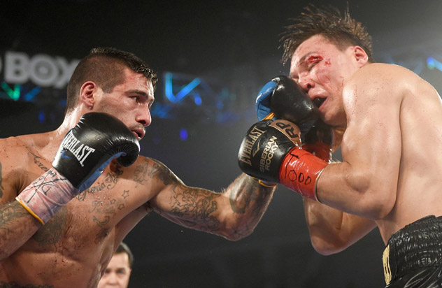 Lucas Matthysse (L) nails Ruslan Provodnikov (R) with a left uppercut during their Fight of the Year candidate in 2015. Provodnikov, who has since taken on new trainer Joel Diaz in hopes of improving his defensive technique, dropped a close decision. Photo by Naoki Fukuda