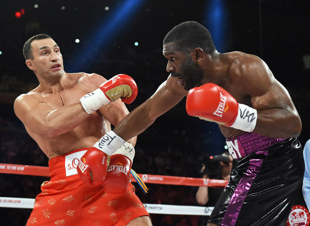 Jennings (r) attacks Klitschko. Photo by Timothy A. Clary/AFP-Getty Images