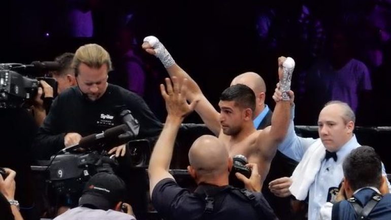 Amir Khan outpoints game Chris Algieri in competitive fight