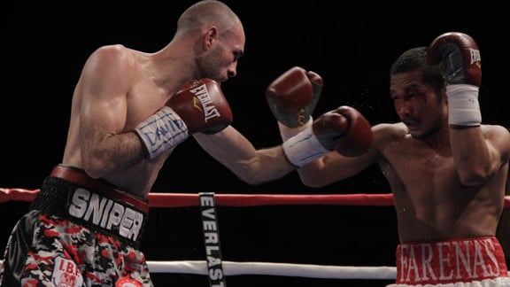 Jose Pedraza (left) engages Michael Farenas in a wide unanimous decision win in Nov. 2014. Photo by Victor Planas/Universal Promotions