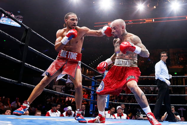 TAMPA, FL - JULY 11: Keith Thurman (L) exchanges blows with Luis Collazo during their welterweight contest on July 11, 2015 at the USF Sun Dome in Tampa, Florida. (Photo by Brian Blanco/Getty Images)