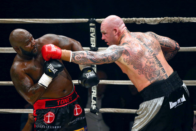 James Toney (L) attempts to summon his once-otherworldly ability to slip a punch, but the then-44-year-old would lose by unanimous decision to Lucas Browne in 2013. Photo by Scott Heavey/Getty Images.