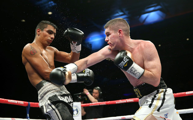 Liam Smith (R) on his way to a seventh-round TKO of David Ezequiel Romero in April 2015. Photo by Alex Livesey/Getty Images.