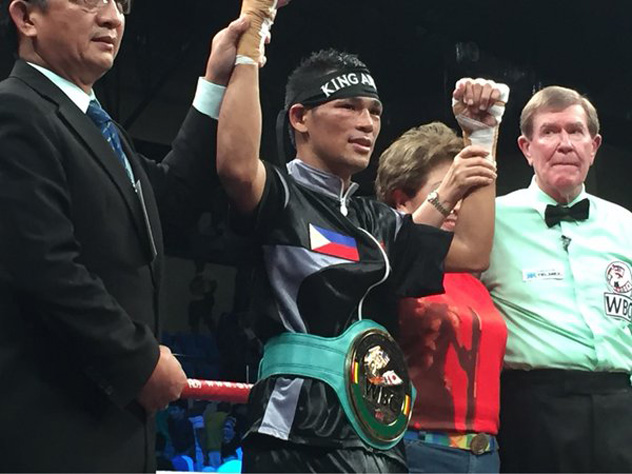 Arthur Villanueva's hand raised in victory