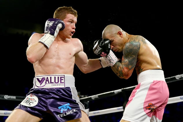LAS VEGAS, NV - NOVEMBER 21:  (L-R)  Canelo Alvarez throws a left at Miguel Cotto during their middleweight fight at the Mandalay Bay Events Center on November 21, 2015 in Las Vegas, Nevada.  (Photo by Al Bello/Getty Images)